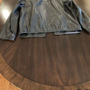 Men’s black leather motorcycle jacket.